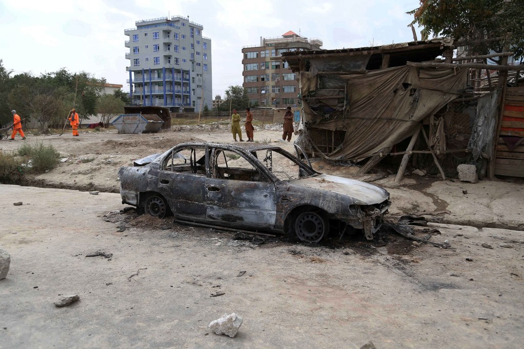 A damaged car which was the source of a rocket being launched at the Kabul airport as US forces attempted to evacuate.