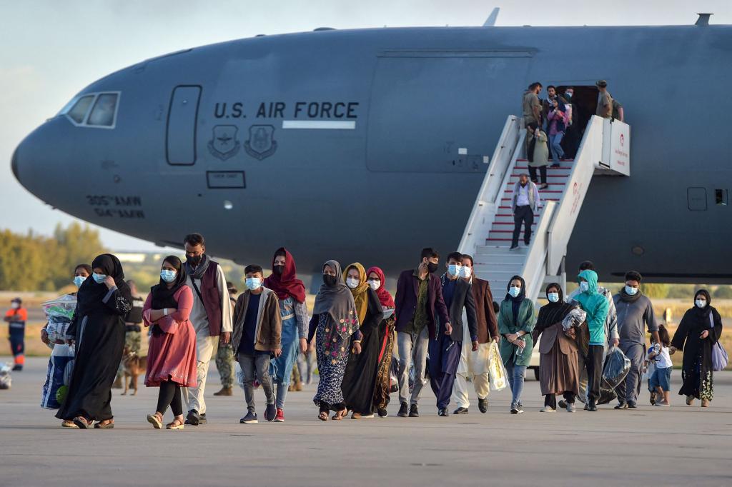 Afghanistan refugees disembark from a US air force aircraft in Spain on August 31, 2021.