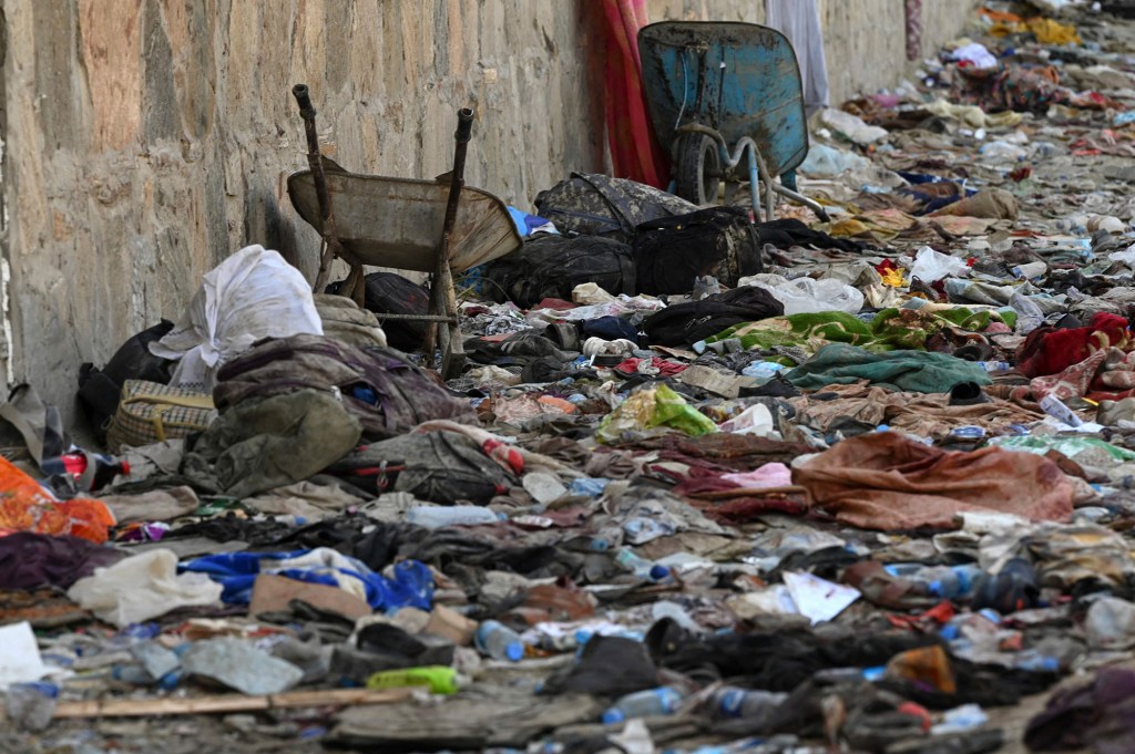 Backpacks and belongings of Afghan people who were waiting to be evacuated are seen at the site of the Aug. 26 bombing, which killed scores of people.