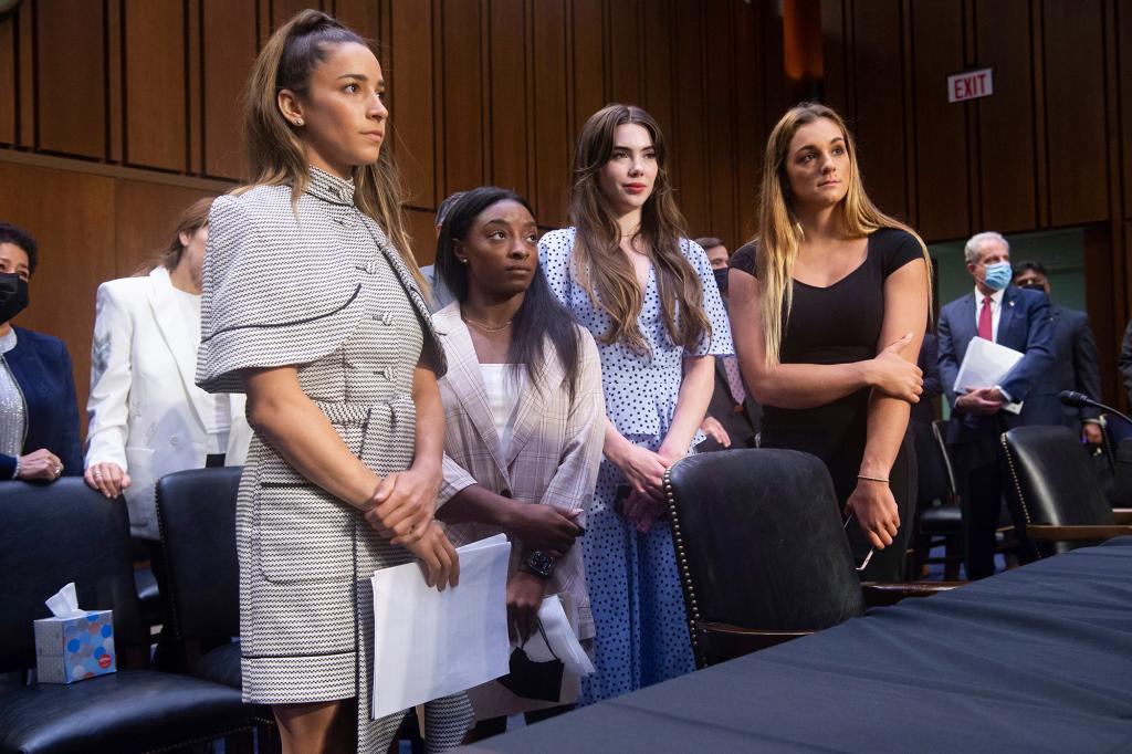 United States gymnasts from left, Aly Raisman, Simone Biles, McKayla Maroney and Maggie Nichols, leave after testifying at a Senate Judiciary hearing about the Inspector General's report on the FBI's handling of the Larry Nassar investigation