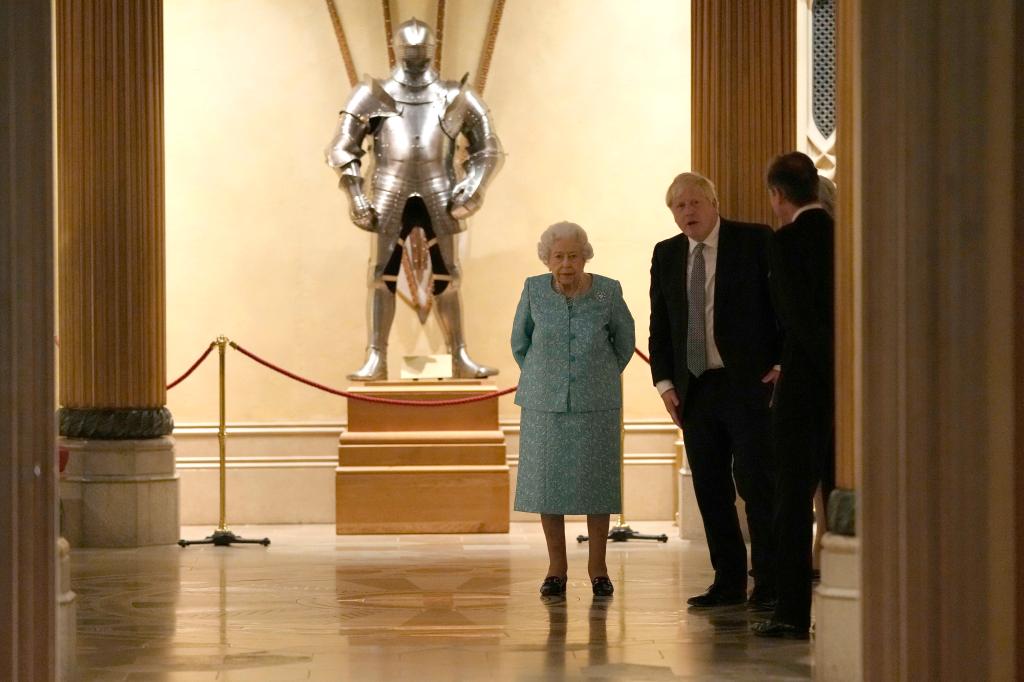  Queen Elizabeth II (left) and Prime Minister, Boris Johnson (right) arrive to greet guests during a reception for international business and investment leaders at Windsor Castle.