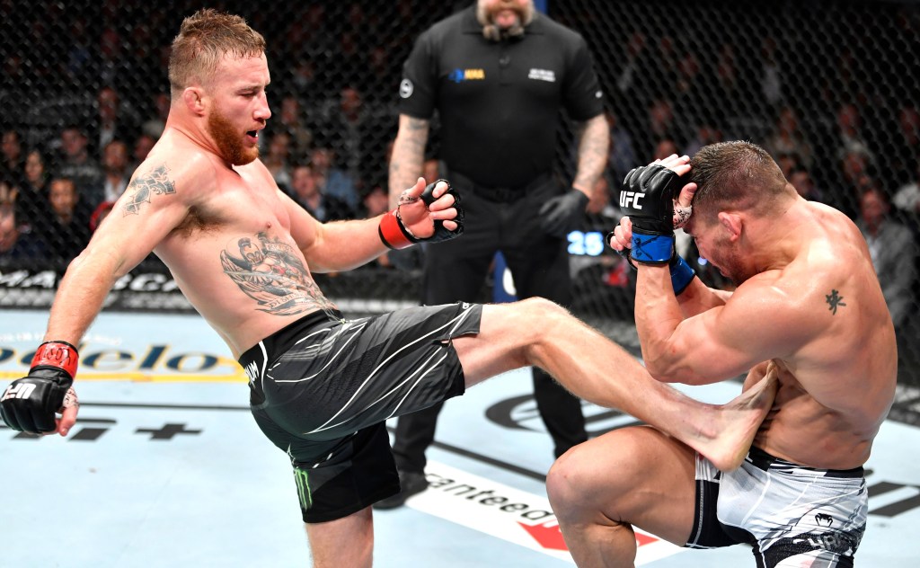 Justin Gaethje kicks Michael Chandler during his victory at UFC 268.