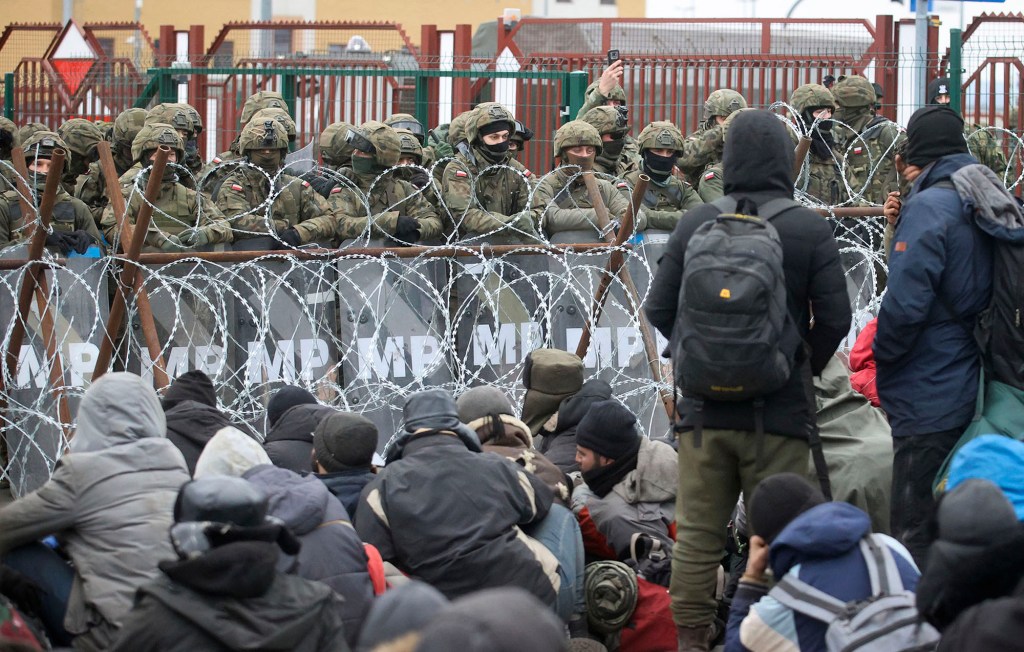 Migrants from the Middle East gather at the checkpoint "Kuznitsa" at the Belarus-Poland border near Grodno, Belarus, on November 15, 2021.