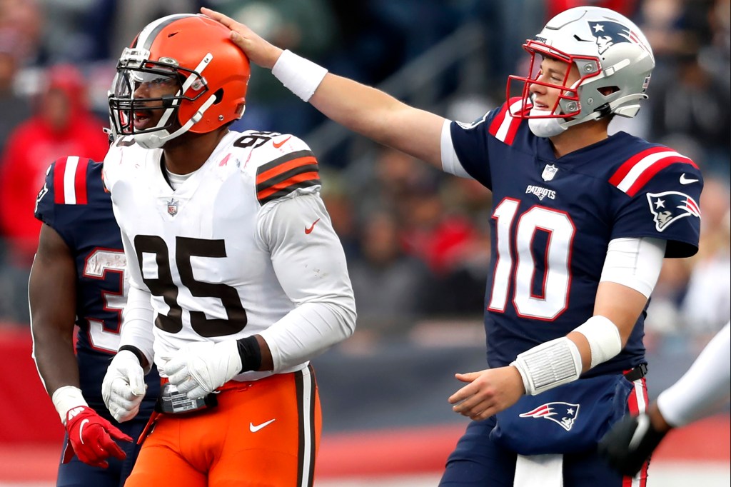 Myles Garrett (left) and Mac Jones during the Patriots' 45-7 win over the Browns.