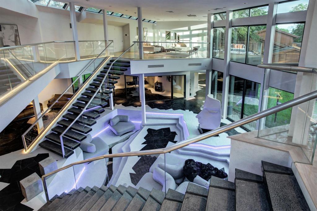 Two staircases lead to the main living area that surrounds the conversation pit.