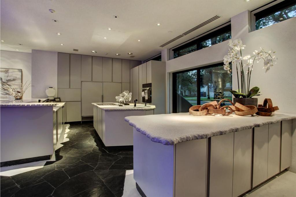 The kitchen has hand-cut stone counters.