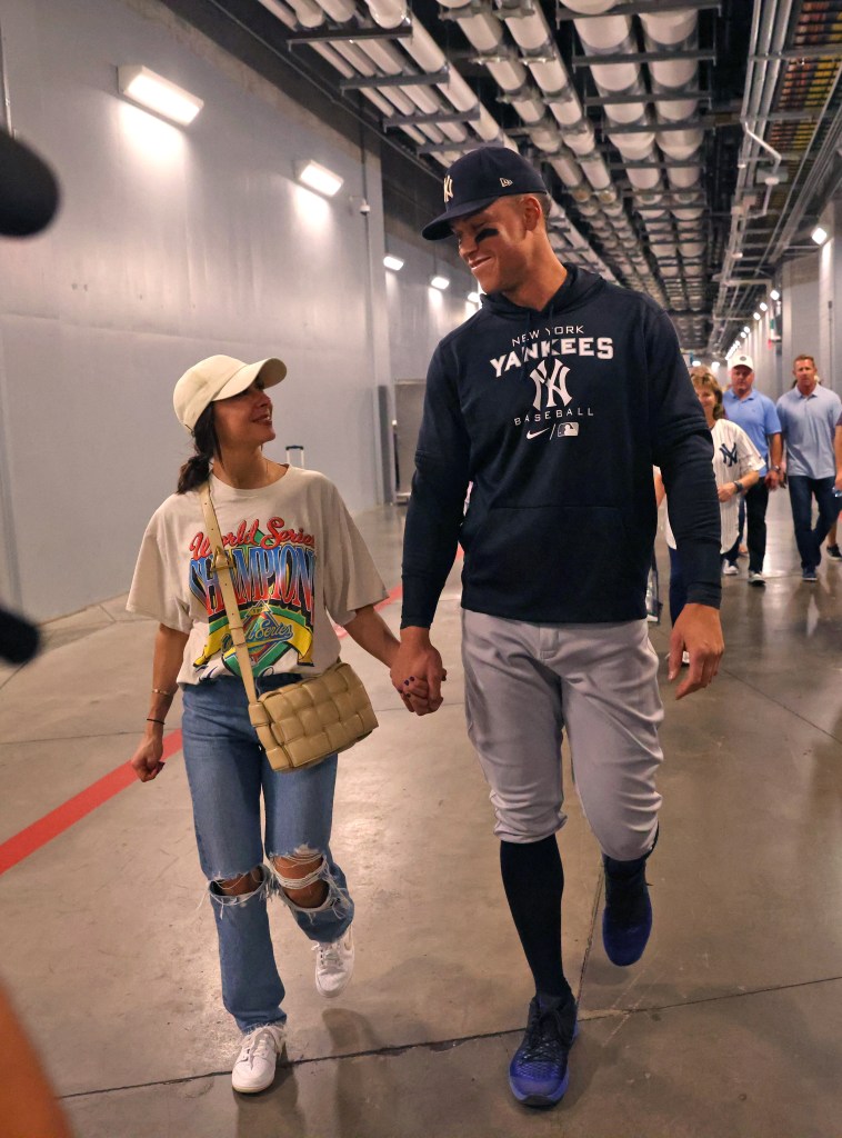 Samantha Bracksieck and Aaron Judge held hands in October 2022 after he broke Roger Maris' American League single-season home run record.