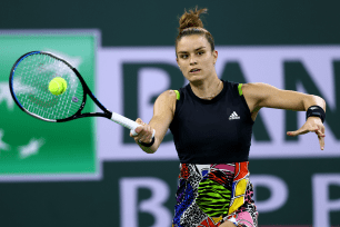 Maria Sakkari plays a forehand against Paula Badosa in their semifinal match during the BNP Paribas Open on March 18, 2022.