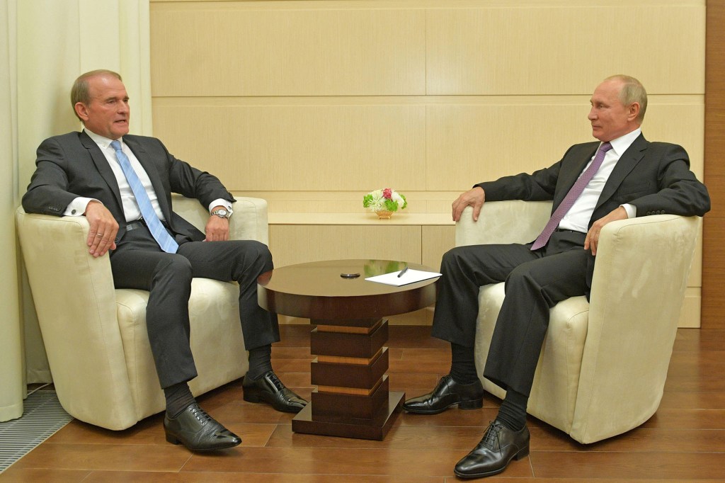 Viktor Medvedchuk (L), the chairman of the council of Ukraine's Opposition Platform - For Life, and Russia's President Vladimir Putin during a meeting at the Novo-Ogaryovo residence  