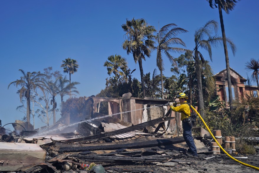 A massive mansion lies in ruins after the Coastal Fire swept through Laguna Niguel.