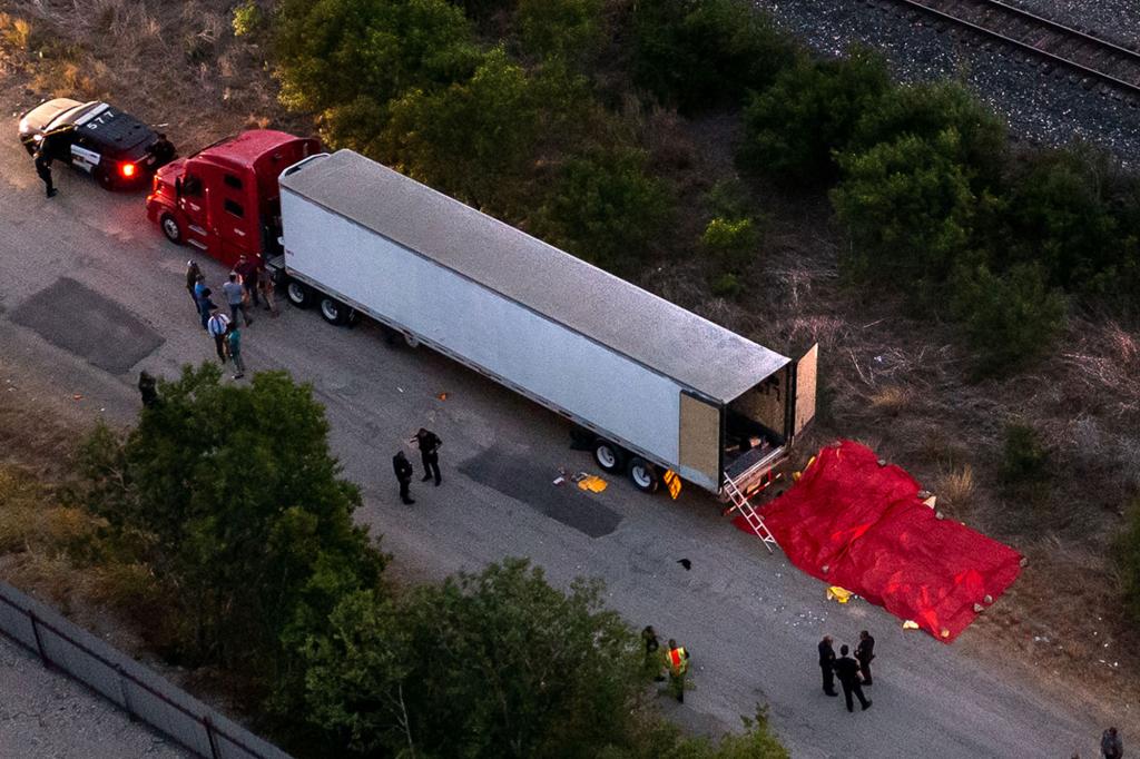 Police at the scene of where at least 50 migrants were found dead in the back of a truck near San Antonio, Texas on June 27, 2022.