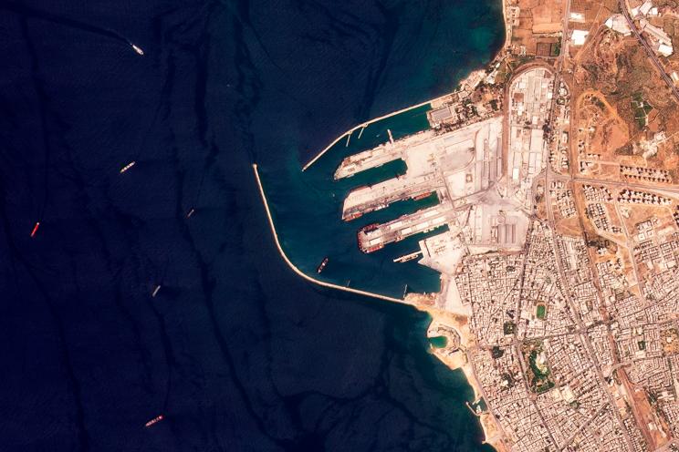 This satellite image from Planet Labs PBC shows the Russian-flagged cargo ship SV Konstantin, the red vessel the furtherest left, off the port in Tartus, Syria, Wednesday, Aug. 17, 2022.