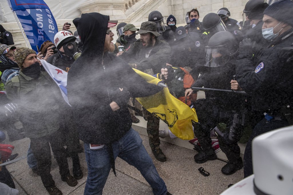 A far-right militiaman who brought a gun to the US Capitol on Jan. 6 was sentenced to more than seven years in prison.