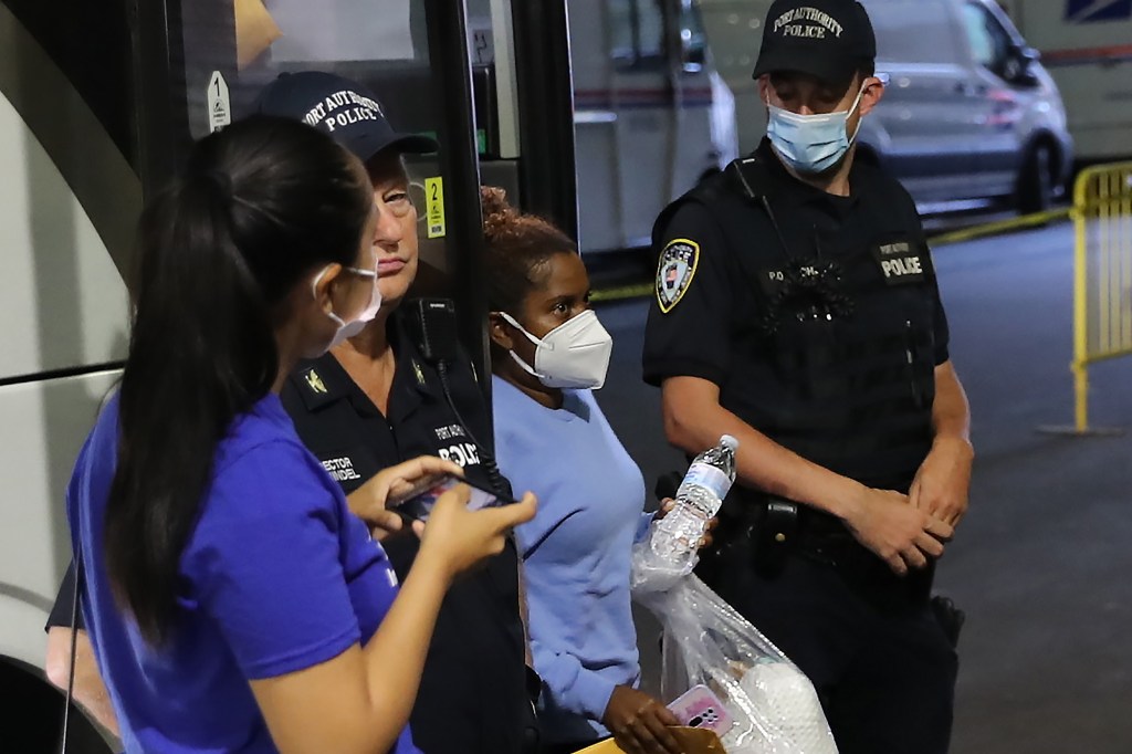 New York City at the 42nd Street bus terminal in Manhattan refugees arrives in New York City