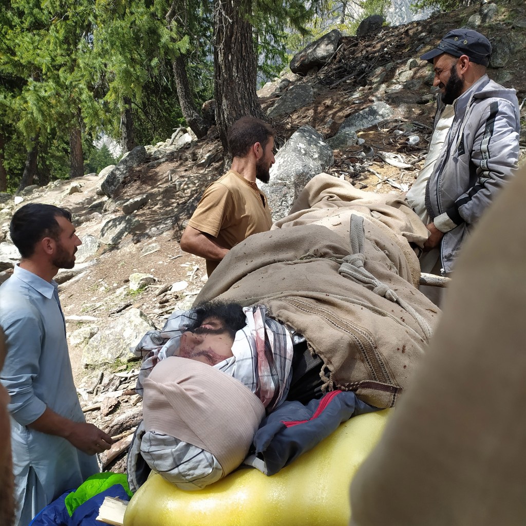 Local samaritans carried Bukhari to base on an improvised stretcher.