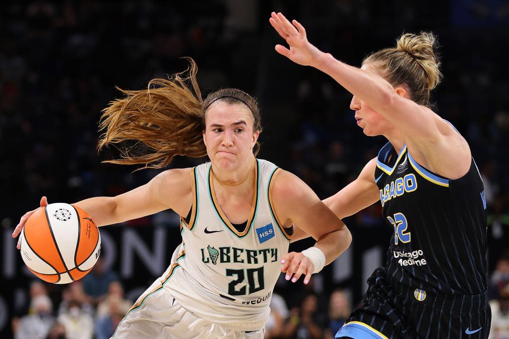 Sabrina Ionescu #20 of the New York Liberty drives to the basket against Courtney Vandersloot #22 of the Chicago Sky during the second half in Game One of the First Round of the 2022 WNBA Playoffs at Wintrust Arena on August 17, 2022 in Chicago, Illinois.