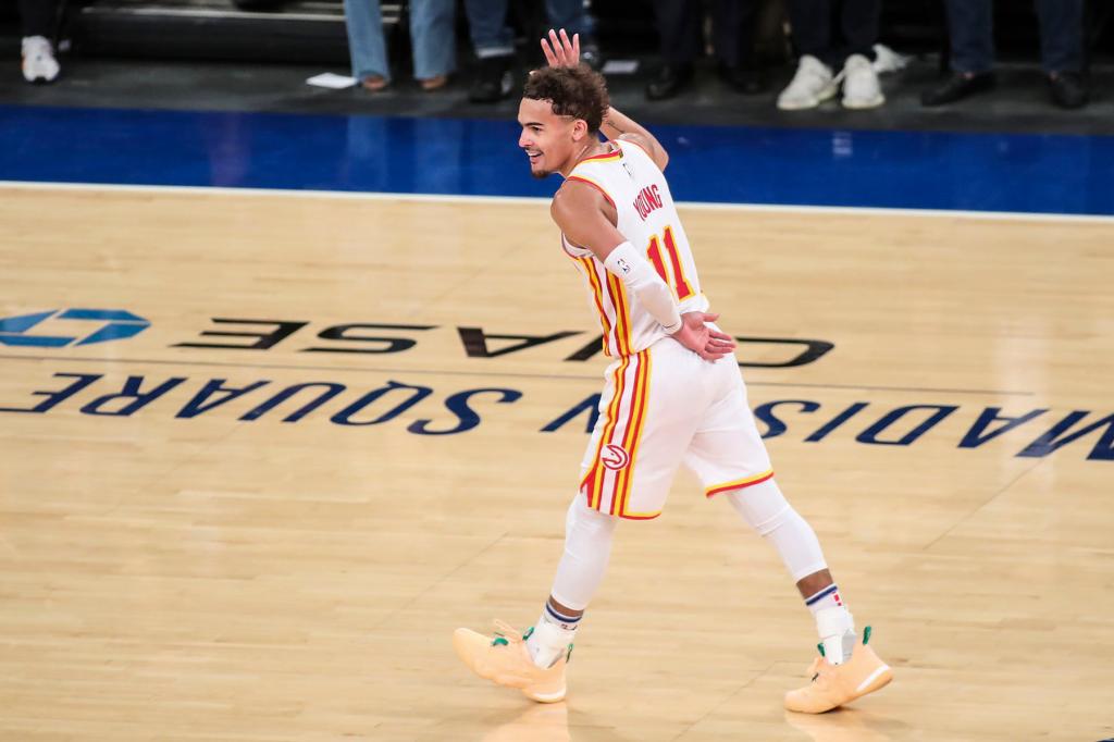 Trae Young (11) of the Atlanta Hawks reacts after scoring a three-point shot against the New York Knicks in the fourth quarter of Game Five of the Eastern Conference first round series at Madison Square Garden on June 02, 2021 in New York City. 