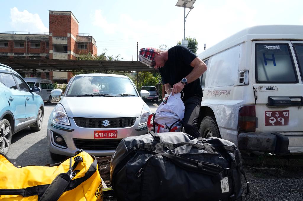 Jim Morrison, packs his bag after the body of his partner and famed U.S. extreme skier, Hilaree Nelson, arrives in a helicopter at a hospital in Kathmandu