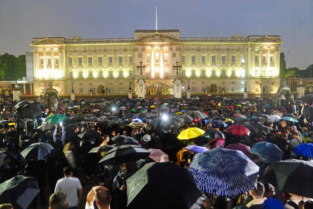 People gathered outside of Buckingham Palace in London after the announcement of Queen Elizabeth's death.