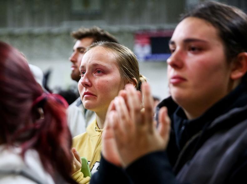 An attendee cries as family members of the victims speak to the crowd during a vigil at the University of Idaho for four students found dead in their residence on November 13 in Moscow, Idaho, U.S., November 30, 2022.