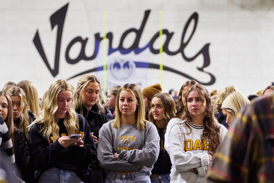 People gather during a campus vigil for four University of Idaho students that were fatally stabbed on Wednesday, November 30, 2022.