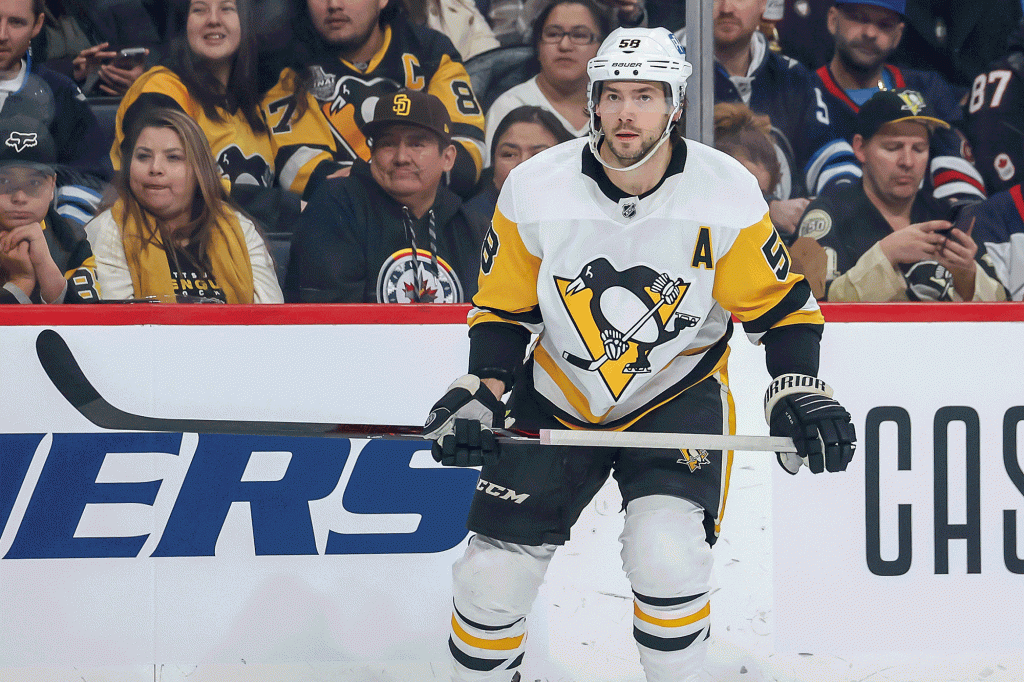 Kris Letang #58 of the Pittsburgh Penguins keeps an eye on the play during first period action against the Winnipeg Jets at the Canada Life Centre on November 19, 2022 in Winnipeg, Manitoba, Canada. (Photo by Jonathan Kozub/NHLI via Getty Images)