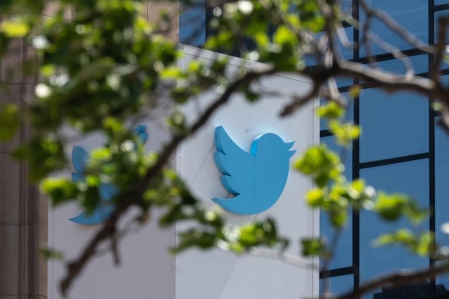 A picture of the Twitter logo at their headquarters.