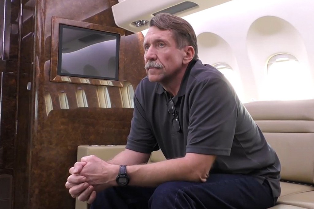 Viktor Bout is seen on a plane ahead of departing for Russia on Dec. 8, 2022.