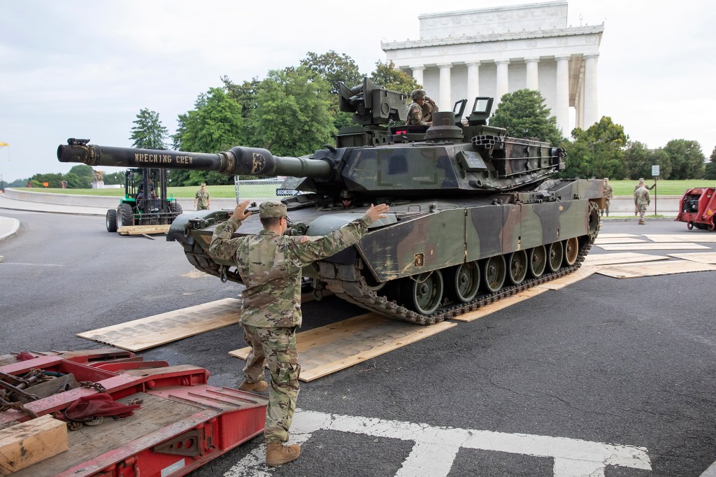 US Army soldiers position a M1 Abrams main battle tank into position at the Lincoln Memorial  for US Independence Day celebrations in 2019.