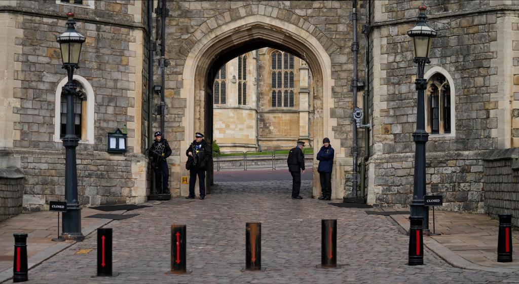 Police guard the Henry VIII gate to Windsor Castle.