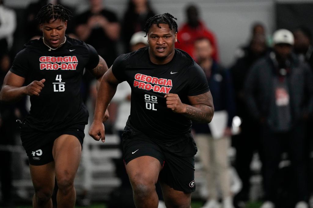 Former Georgia defensive lineman Jalen Carter runs football drills during Georgia's Pro Day, on March 15, 2023, in Athens, Ga.