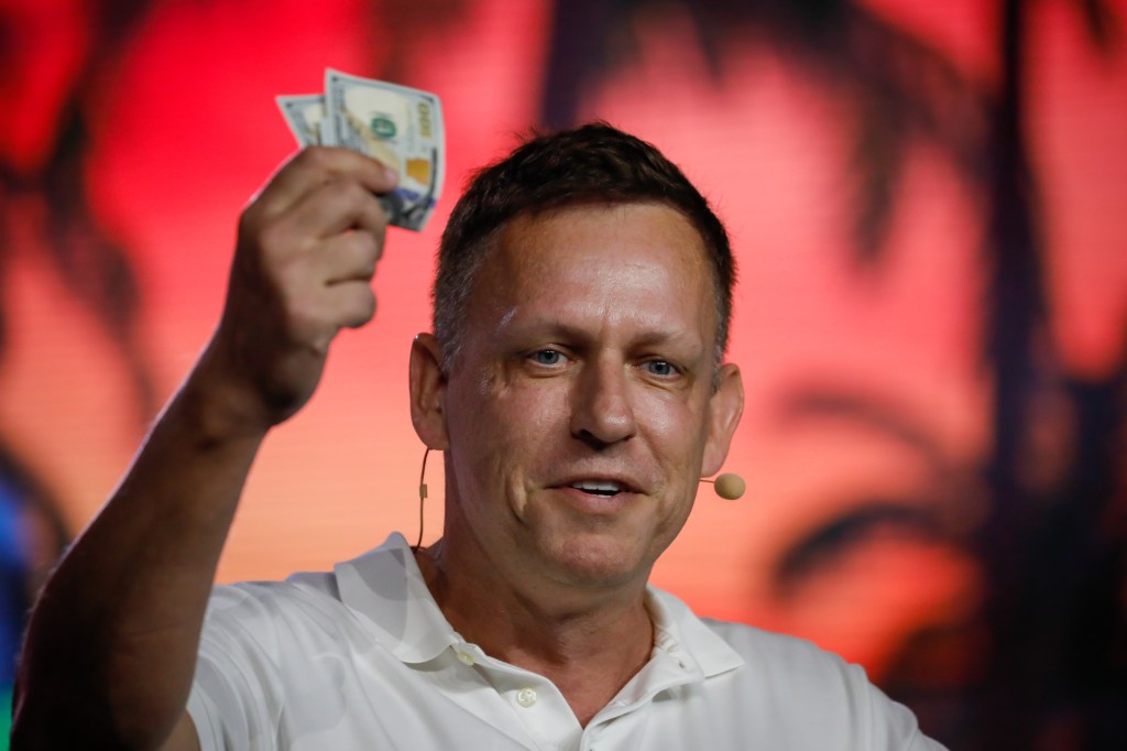 Peter Thiel holding up some cash.