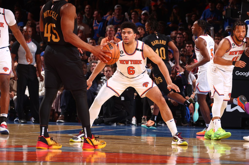 Quentin Grimes plays defense against the Cavaliers.