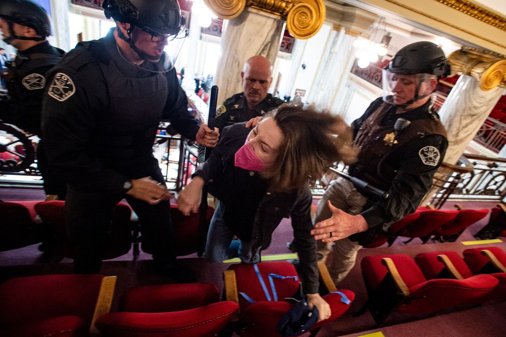 Law enforcement forcibly clear the Montana House of Representatives gallery during a protest after the Speaker of the House refused again to acknowledge Rep. Zooey Zephyr, D-Missoula, on Monday, April 24, 2023, in the State Capitol in Helena, Mont.