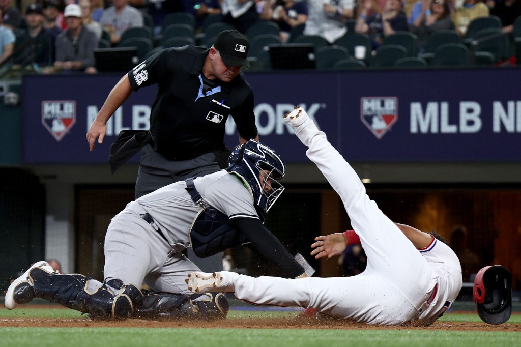 Jose Trevino tags out Ezequiel Duran at the plate during the third inning of the Yankees' loss.