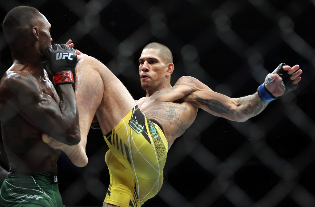 Alex Pereira lands a kick on Israel Adesanya during their middleweight fight at UFC 281 at Madison Square Garden on Nov. 12, 2022.