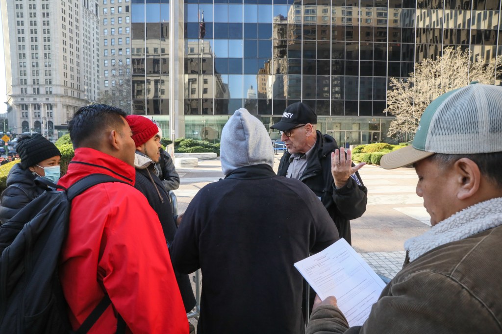 Migrants with ICE appointments waiting outside of 26 Federal Plaza.