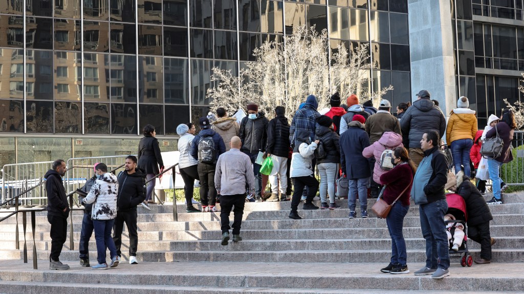 Migrants with ICE appointments waiting outside of 26 Federal Plaza.