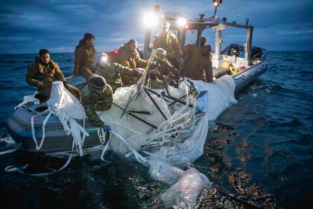 Members of the US Navy recover the high-altitude Chinese balloon from the waters of South Carolina in February 2023. The ballon shot-down was a major nail-in-the-coffin for UFOology.