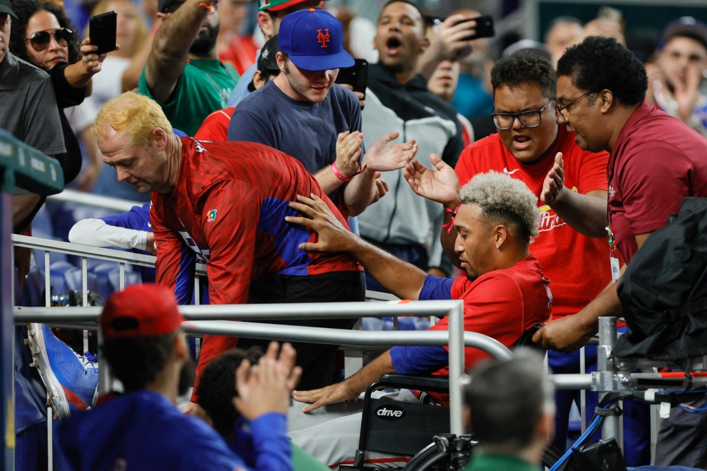 Edwin Diaz in a wheelchair after being injured during the World Baseball Classic.