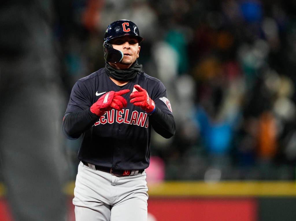 Cleveland Guardians' Andres Gimenez gestures as he runs the bases after hitting a home run against the Seattle Mariners in the seventh inning during a baseball game Saturday, April 1, 2023, in Seattle.