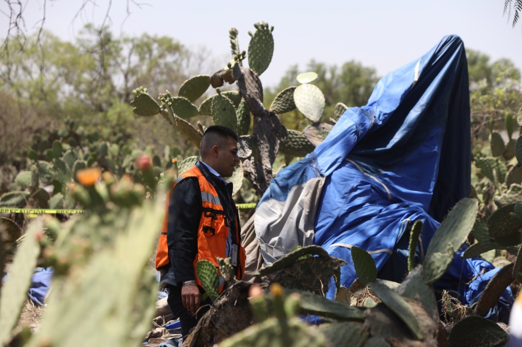 An investigator at the crash hot air balloon area on April 1, 2023.