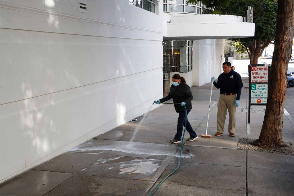 Workers cleaning the area on April 5, 2023.