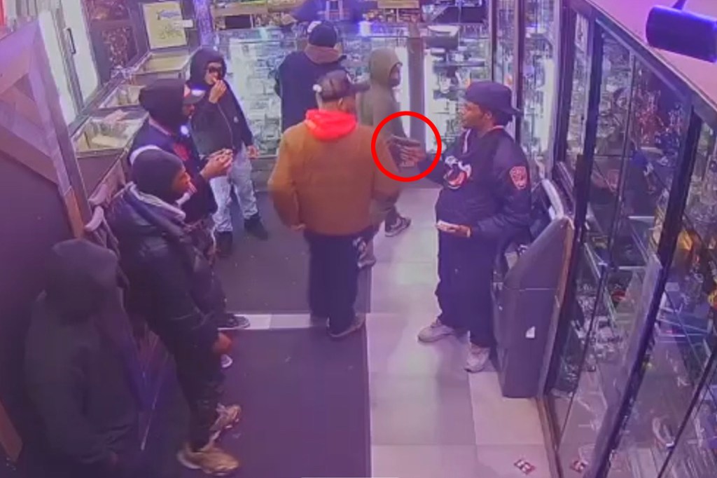 Another screengrab of Messiah Nantwi allegedly flashing a gun at the smoke shop. 