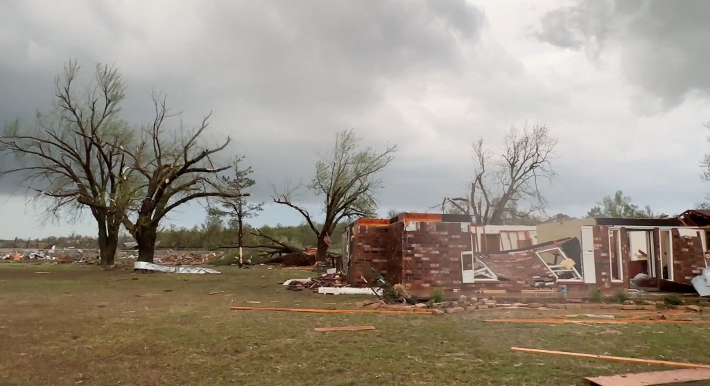 A general view shows damage from a rain-wrapped tornado in Cole, Oklahoma.