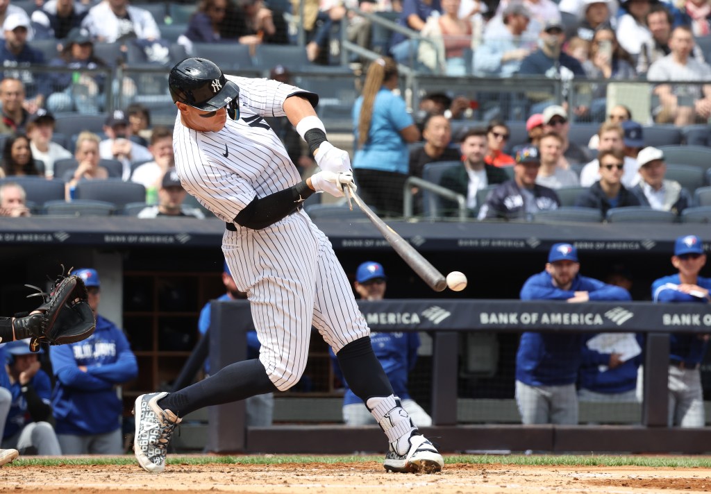 Yankees center fielder Aaron Judge breaks his bat on a ground out with two runners on to end the third inning against the Blue Jays.