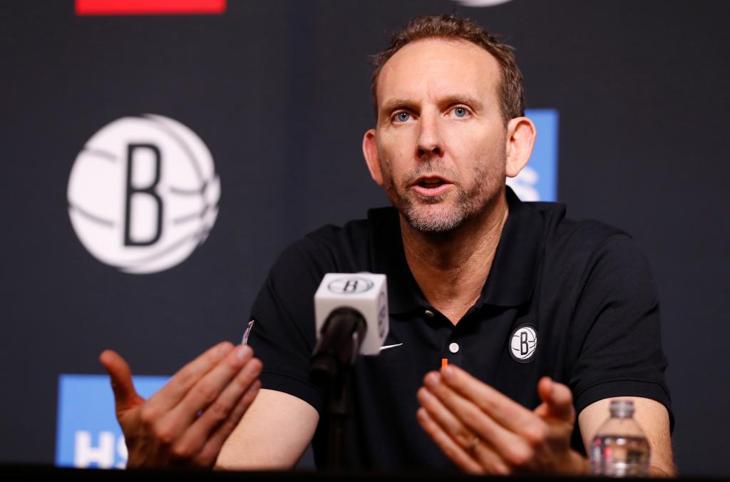 Nets GM Sean Marks speaks at a press conference.