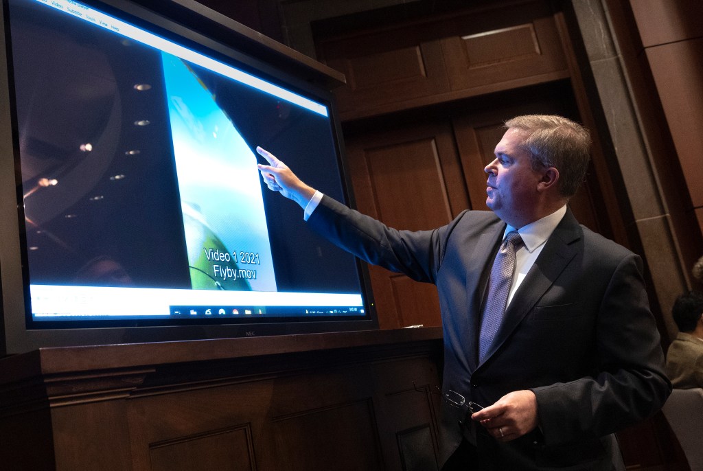 U.S. Deputy Director of Naval Intelligence Scott Bray explains a video of an unidentified aerial phenomena.