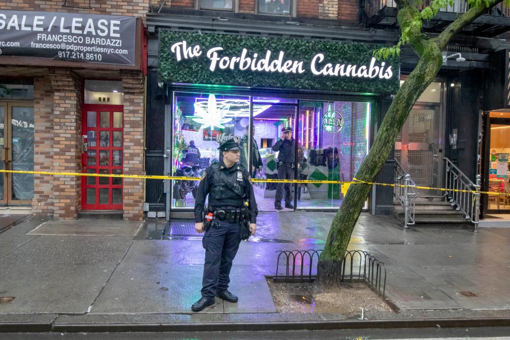 NYPD at the scene of a person shot near the Forbidden Cannabis store on 9th Ave near  46th St in Hell's Kitchen neighborhood of Manhattan.