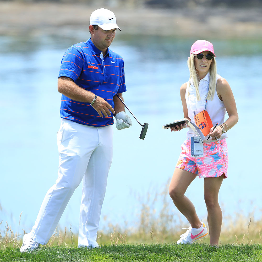 Patrick Reed of the United States (L) and his wife, Justine Karain, talk on the fifth hole during a practice round prior to the 2019 U.S. Open at Pebble Beach Golf Links on June 11, 2019 in Pebble Beach, California.